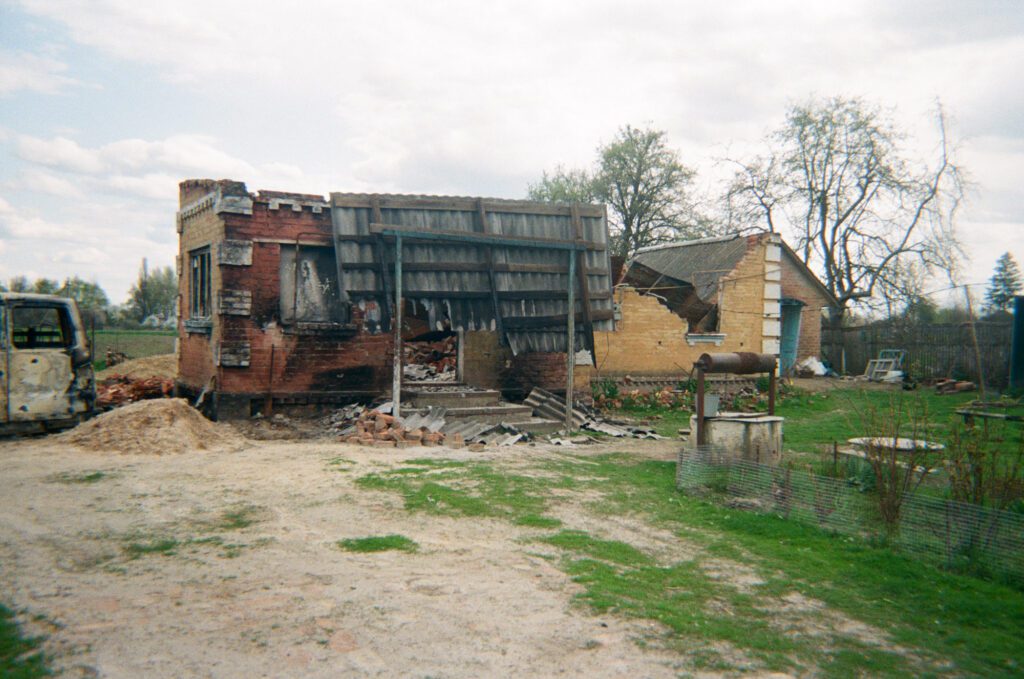 “Here is our gate. Our yard was bombed, and the shed. We were in the cellar, right there.”